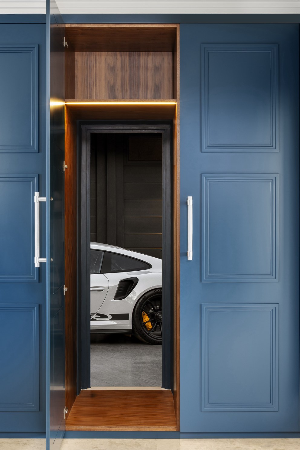Sea front family home  | Entrance hall cabinetry - secret door into garage | Interior Designers